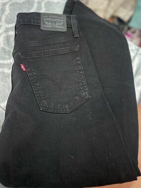 Levi's women’s button fly high rise Black Jeans relaxed fit 27